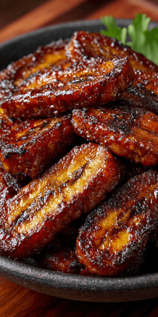 plantains
Close-up of caramelized plantains catching the light, glossy texture. Warm tone gradient (coral to turmeric).